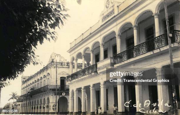 View of the municipal assembly building just off of the Parque Marti, the largest park in the town of Ciego de Avila, Cuba, 1930s.