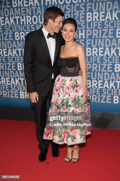 Actors Ashton Kutcher and Mila Kunis arrive at the 2018 Breakthrough Prize at NASA Ames Research Center on December 3, 2017 in Mountain View,...