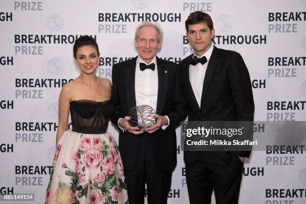 Presenter Mila Kunis, award winner Dr. Kim Nasmyth and presenter Ashton Kutcher pose for photos after award ceremony at the 2018 Breakthrough Prize...