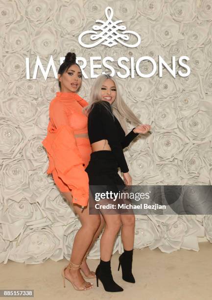 Melly Sanchez and Isabel Bedoya attend #MelroseIsLit: Impressions Vanity Melrose Grand Opening Gala on December 2, 2017 in Los Angeles, California.