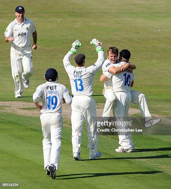 Chris Nash of Sussex jumps onto Luke Wright as they celebrate taking the wicket of Alfonso Thomas of Somerset during the LV County Championship...