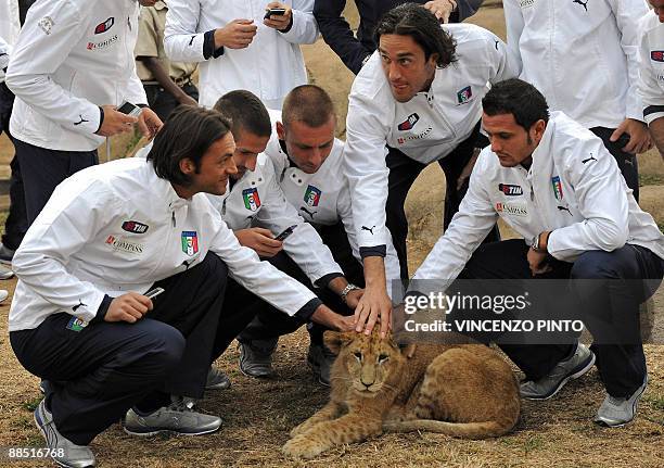 Italian football players, midfielder Riccardo Montolivo, defender Alessandro Gamberini, midfielder Daniele De Rossi, forward Luca Toni and forward...