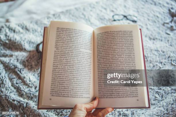 hands  holding open book - book fotografías e imágenes de stock