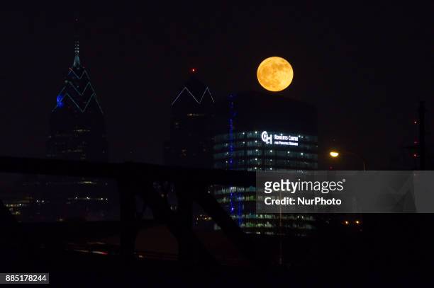The first and only supermoon of the year, the December 3, 2017 Frost Moon, rises behind the Center City Philadelphia, PA skyline.