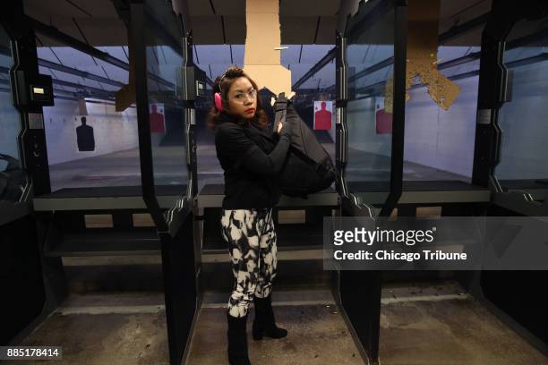 Sonia Figueroa passes her shooting test and packs up her gun, getting ready to leave the range, on Sunday, Nov. 12, 2017 at the Eagle Sports Range in...