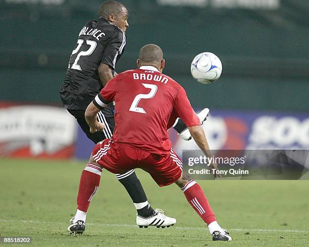 Rodney Wallace of D.C. United flicks the ball over C.J. Brown of the Chicago Fire during an MLS match at RFK Stadium on June 13, 2009 in Washington,...