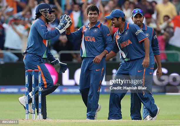 Ravindra Jadeja of India is congratulated by his team mates after taking the wicket of AB de Villiers of South Africa during the ICC World Twenty20...