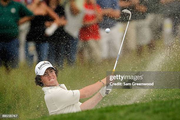 Rory McIlroy of Northern Ireland plays from a bunker during the second day of previews to the 109th U.S. Open on the Black Course at Bethpage State...