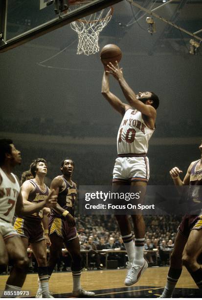 S: Walt Frazier of the New York Knicks in action lays the ball up against the Los Angeles Lakers during a early circa 1970's NBA basketball game at...
