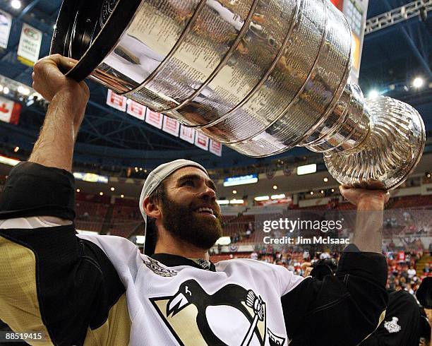 Pascal Dupuis of the Pittsburgh Penguins celebrates with the Stanley Cup after defeating the Detroit Red Wings by a score of 2-1 to win Game Seven...