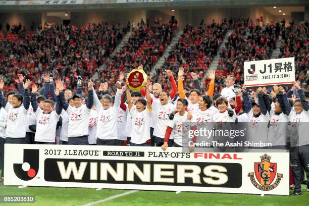 Captain Hisato Sato of Nagoya Grampus lifts the trophy after the J.League J1 Promotion Play-Off Final between Nagoya Grampus and Avispa Fukuoka at...