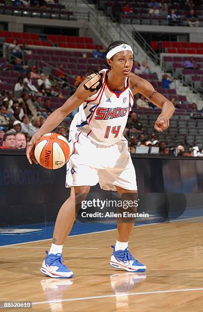 Deanna Nolan of the Detroit Shock moves the ball against the Washington Mystics during the game on June 10, 2009 at The Palace of Auburn Hills in...