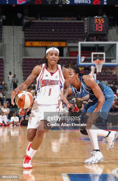 Shavonte Zellous of the Detroit Shock moves the ball past Chasity Melvin of the Washington Mystics during the game on June 10, 2009 at The Palace of...