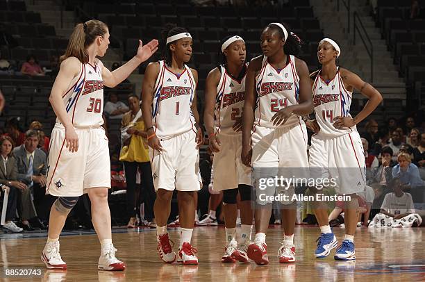 Katie Smith, Shavonte Zellous, Alexis Hornbuckle, Olayinka Sanni and Deanna Nolan of the Detroit Shock walk down the court during the game against...