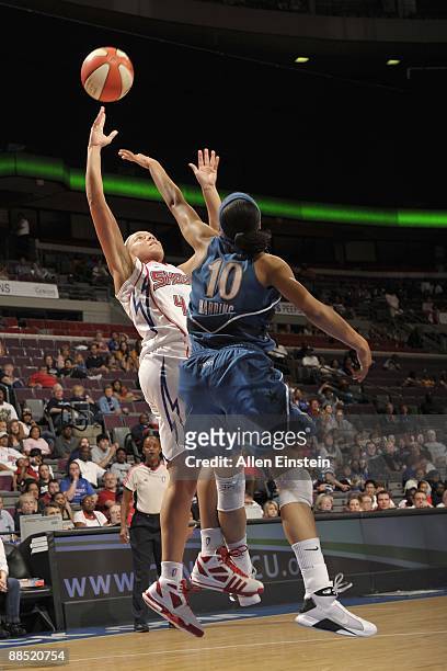 Kristin Haynie of the Detroit Shock looks to shoots against Lindsey Harding of the Washington Mystics during the game on June 10, 2009 at The Palace...