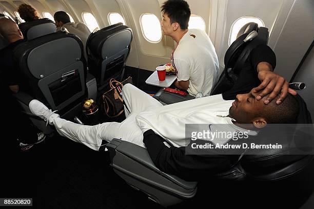 Kobe Bryant of the Los Angeles Lakers relaxes on the team plane on June 15, 2009 after the Lakers defeated the Orlando Magic in the NBA Finals. NOTE...