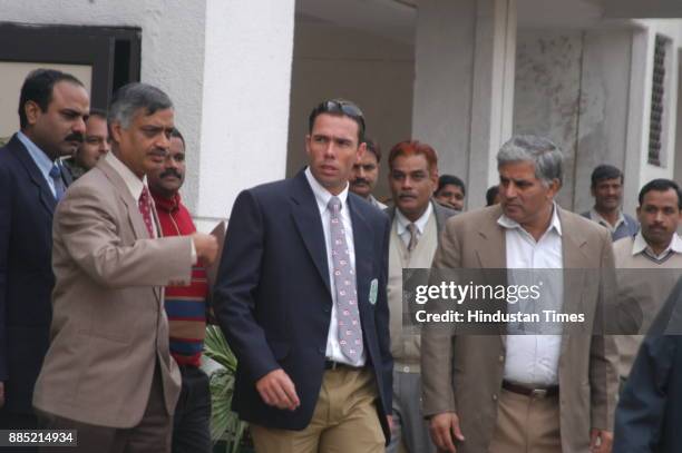 South African cricketer Nicky Boje surrounded by Delhi Police Crime branch officials at Kotwali Police Station in New Delhi on Tuesday. Boje appeared...