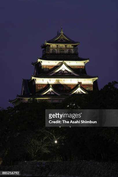Hiroshima Castle shines during a light show casting a spell over the castle in rainbow colours in support of sexual minorities on December 3, 2017 in...