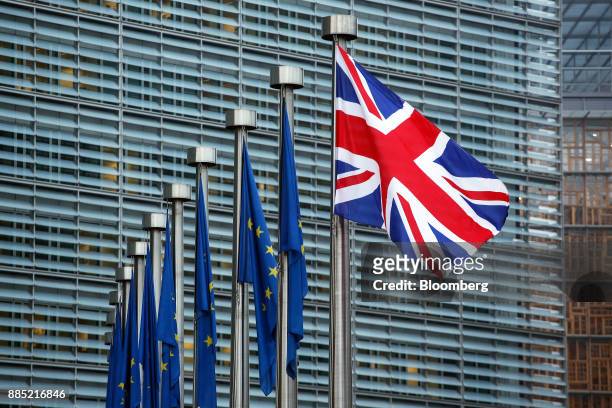 Union flag, also known as a Union Jack, right, sits next to European Union flags outside the European Commission building in Brussels, Belgium, on...