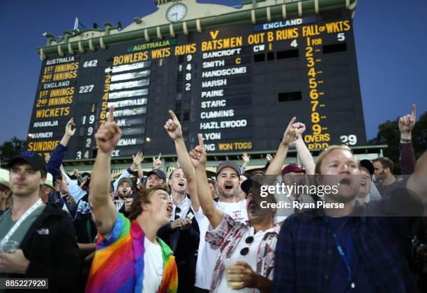 Fans cheer on the hill during day three of the Second Test match during the 2017/18 Ashes Series between Australia and England at Adelaide Oval on...