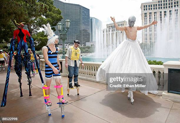 Cirque du Soleil artists and employees, including Eric Newton from the show "Criss Angel Believe," participate in a Guinness World Record stilt...