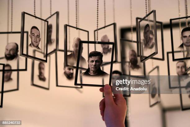 Visitor inspects the photos of martyrs who were martyred during the defeated 15th of July 2016 coup attempt, at the 'July 15 Democracy Museum' built...