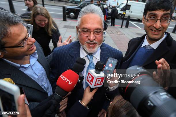 Vijay Mallya, founder and chairman of Kingfisher Airlines Ltd., center, speaks to members of the media as he arrives at Westminster Magistrates'...