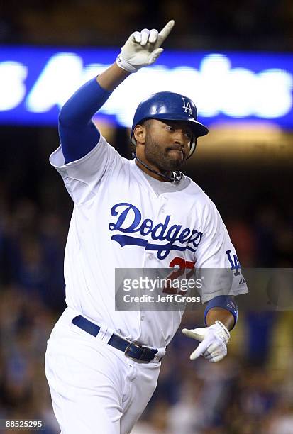 Matt Kemp of the Los Angeles Dodgers celebrates after hitting a base hit scoring the game winning run in the tenth inning against the Oakland...