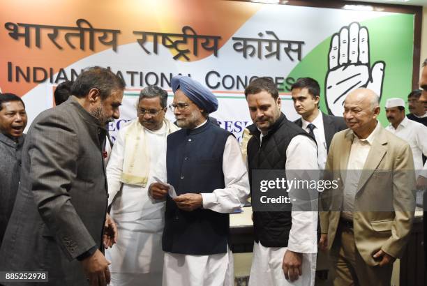 Indian Congress leaders Anand Sharma, Karnataka Chief Minister Siddaramaiah,, former Indian prime minister Manmohan Singh, current Congress Party...