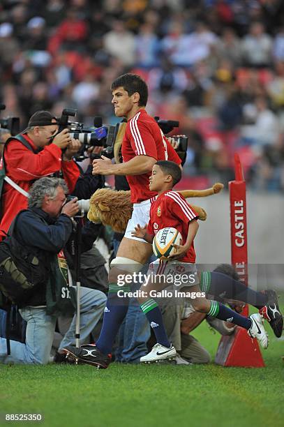 Captain Donncha O'Callaghan of the British and Irish Lions leads his team onto the field during the British and Irish Lions Tour match between...