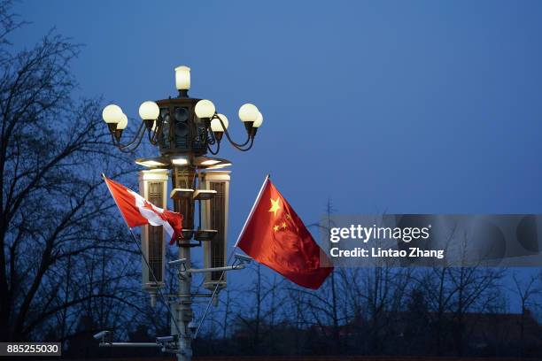 China and Canada flag is displayed in front of the Forbidden City on December 4, 2017 in Beijing, China. At the invitation of Premier Li Keqiang of...