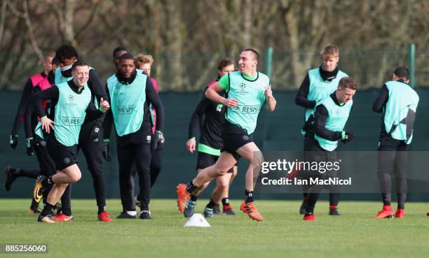 Scott Brown warms up with team mates during a Celtic training session on the eve of their UEFA Champions League match against Anderlecht at...