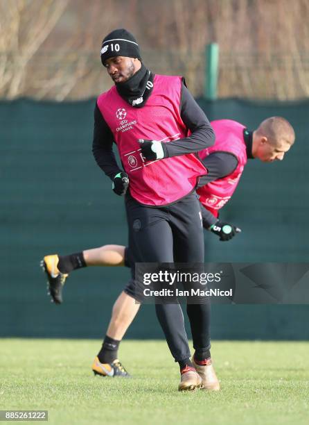 Moussa Dembele warms up with team mates during a Celtic training session on the eve of their UEFA Champions League match against Anderlecht at...