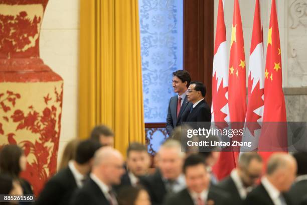 Chinese Premier Li Keqiang shakes hands with Canada's Prime Minister Justin Trudeau before during a welcoming ceremony inside the Great Hall of the...