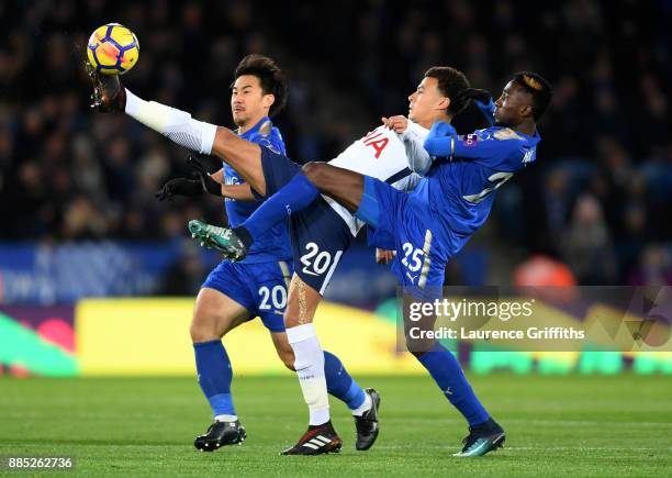 Dele Alli of Tottenham Hotspur wins the ball under pressure from Shinji Okazaki and Wilfred Ndidi and of Leicester City during the Premier League...