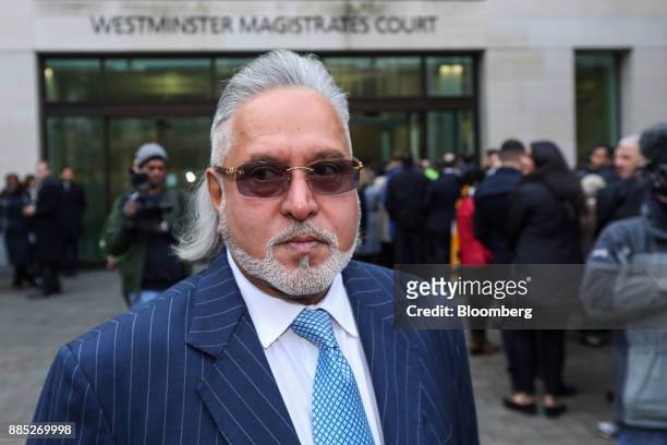 Vijay Mallya, founder and chairman of Kingfisher Airlines Ltd., stands outside Westminster Magistrates' Court after it was evacuated in London, U.K.,...