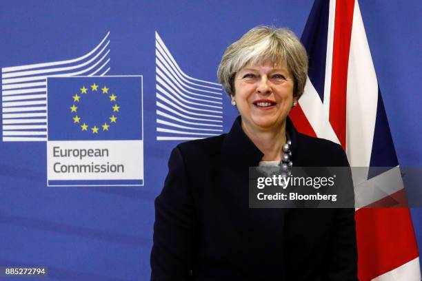 Theresa May, U.K. Prime minister, poses for photographs ahead of a meeting at the European Commission building in Brussels, Belgium, on Monday, Dec....