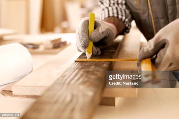 carpenter taking perfect measurement - wood workshop stock pictures, royalty-free photos & images