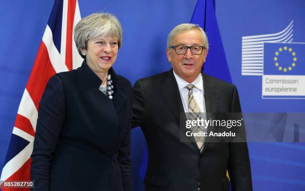 British Prime Minister Theresa May and European Commission Chief Jean-Claude Juncker pose prior to a Brexit negotiation meeting on December 4, 2017...