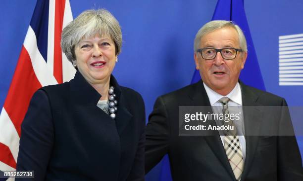 British Prime Minister Theresa May and European Commission Chief Jean-Claude Juncker pose prior to a Brexit negotiation meeting on December 4, 2017...