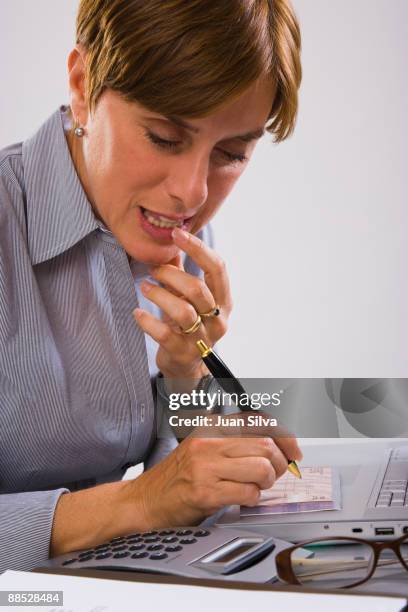 Woman Writecheck Checkbook Writing A Check Photos and Premium High Res Pictures - Getty ...