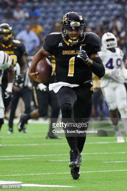 Grambling State Tigers quarterback Devante Kincade finds open field enroute to a first half rushing touchdown during the SWAC Championship football...