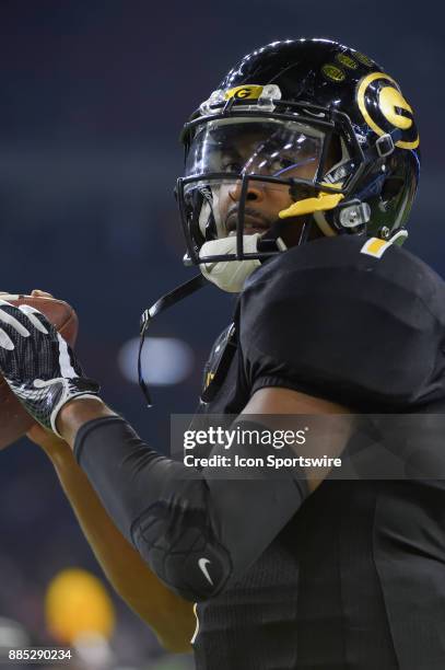 Grambling State Tigers quarterback Devante Kincade warms up before the second half during the SWAC Championship football game between the Alcorn...