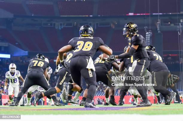 Grambling State Tigers quarterback Devante Kincade hands the ball off to Grambling State Tigers running back Dre' Fusilier deep in his own endzone...