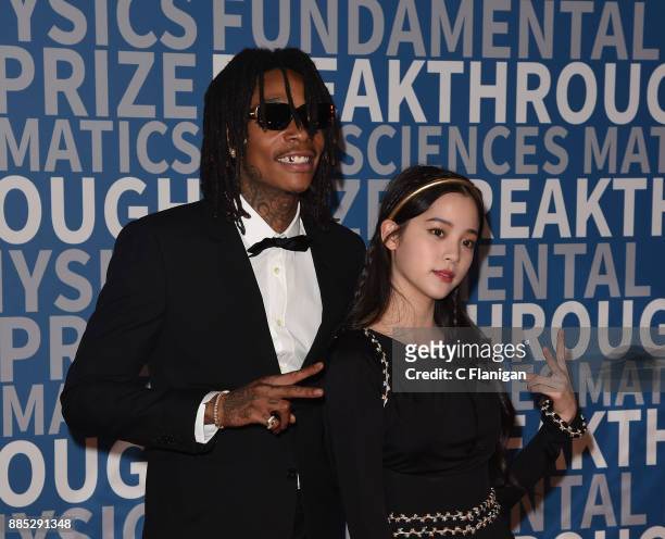 Rapper Wiz Khalifa and Nana Ou-Yang attend the 2018 Breakthrough Prize at NASA Ames Research Center on December 3, 2017 in Mountain View, California.
