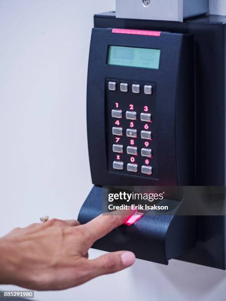 woman using biometric fingerprint scanner - fingerprint scanner stock pictures, royalty-free photos & images