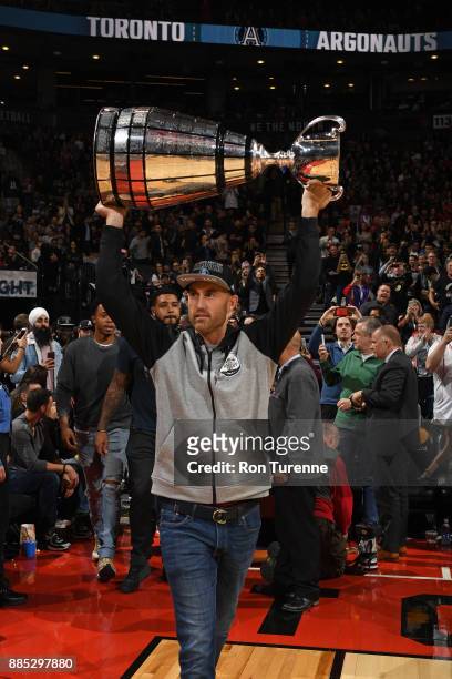 Toronto Argonauts, Ricky Ray carries the Grey Cup to the court during the Indiana Pacers game against the Toronto Raptors on December 1, 2017 at the...