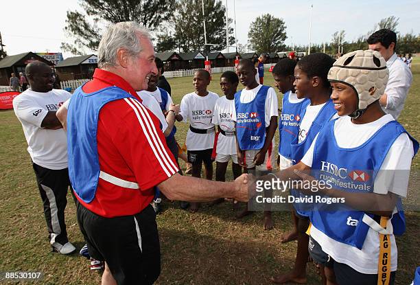 Former British and Irish Lions scrumhalf Gareth Edwards meets local children during the HSBC Durban Rugby Coaching Festival at Kings Park on June 17,...