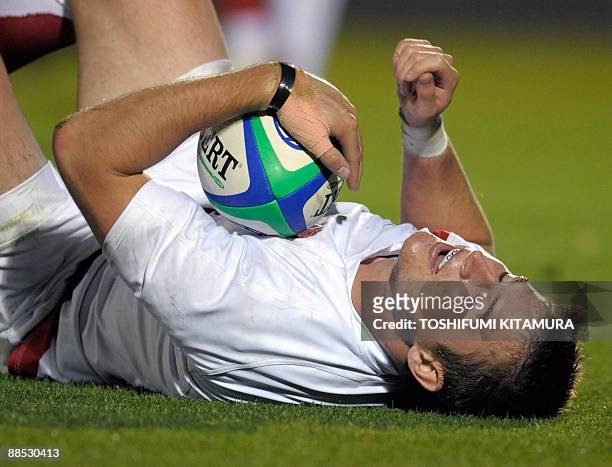 England's centre back Henry Trinder rests after scoring a try during the second half of their semi-final match against South Africa in the 2009 IRB...