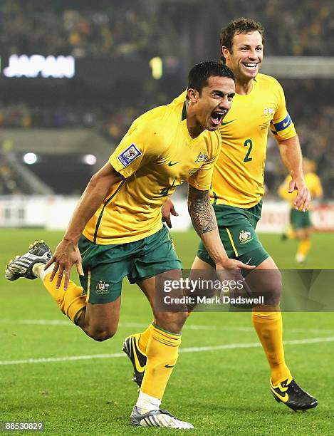 Tim Cahill of the Socceroos celebrates his second goal with team mate Lucas Neil during the 2010 FIFA World Cup Asian qualifying match between the...